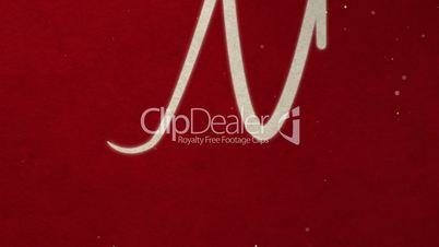 Drawing text MARRY CHRISTMAS on red paper with snow