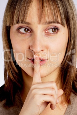 Woman gesturing to silence