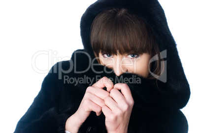 Young woman in fur coat