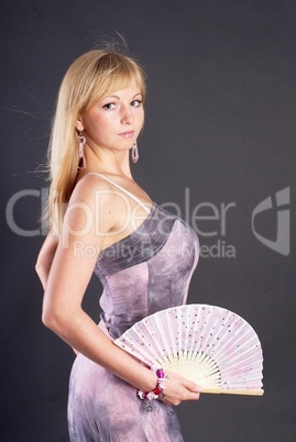 Beautiful young woman with fan