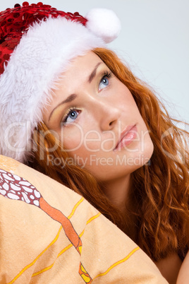 Beauty red woman in santa hat