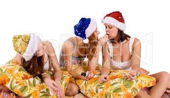 three young woman play on pillows