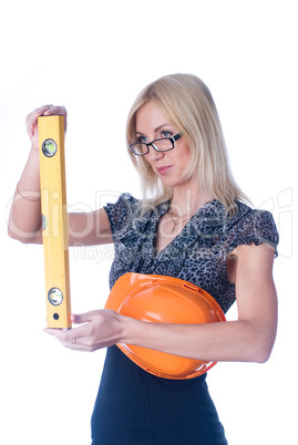 Woman in helmet with level