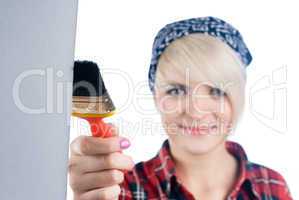 Young woman with paintbrush