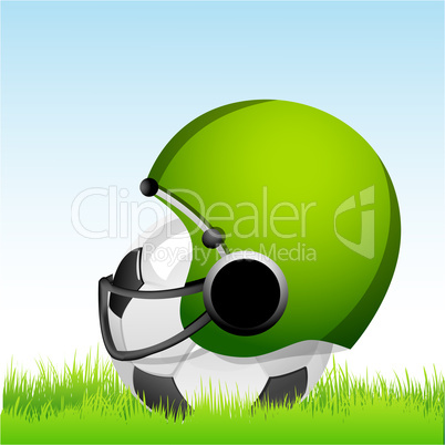 football with helmet on grass