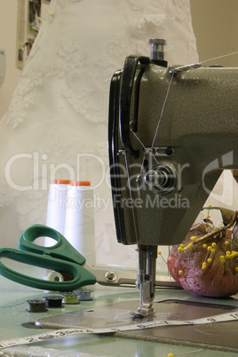 an image of a Antique sewing machine with wedding dress