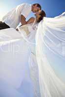 Bride & Groom Married Couple Kissing at Beach Wedding