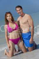 Healthy Middle Aged Couple in Swimsuits on A Beach