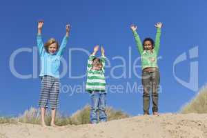 Three Children Arms Raised Having Fun on Beach