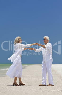 Happy Senior Couple Dancing Holding Hands on A Tropical Beach