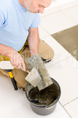 Home improvement, renovation - handyman laying tile