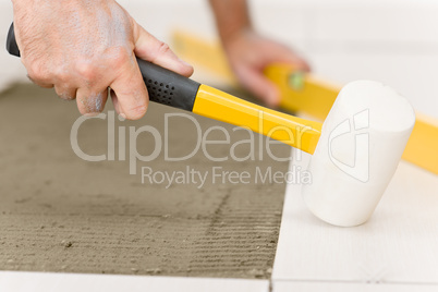 Home improvement, renovation - handyman laying tile