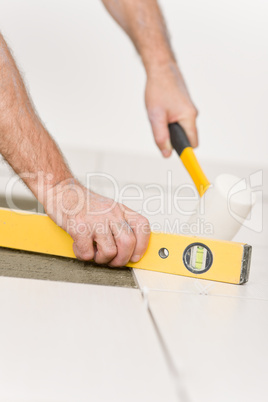 Home improvement, renovation - handyman laying tile