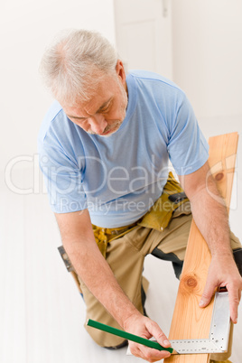 Home improvement - handyman installing wooden floor