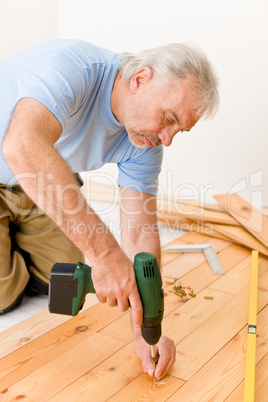 Home improvement - handyman installing wooden floor