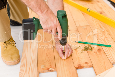 Home improvement - handyman installing wooden floor