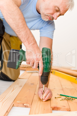 Home improvement - handyman installing wooden floor