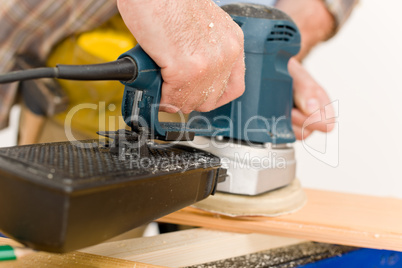 Home improvement - handyman sanding wooden floor