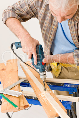 Home improvement - handyman drilling wood