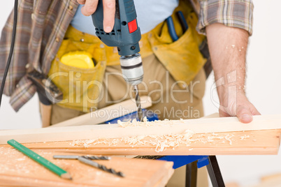 Home improvement - handyman drilling wood