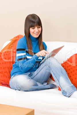 Teenager girl relax home with touch screen tablet computer