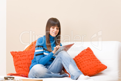 Teenager girl relax home with touch screen tablet computer