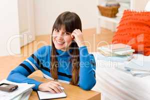 Teenager girl home - student write homework