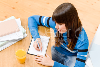 Teenager girl home - student write homework