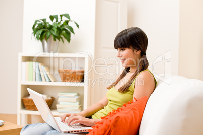 Teenager girl relax home - happy with laptop