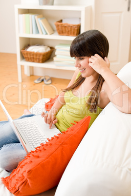 Teenager girl relax home - happy with laptop