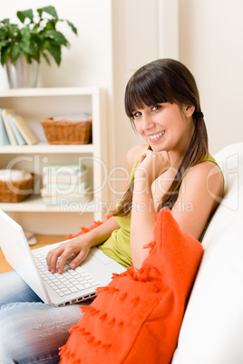 Teenager girl relax home - happy with laptop