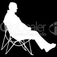 man sitting on black background