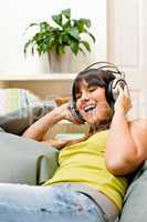 Teenager girl relax home - happy listen to music