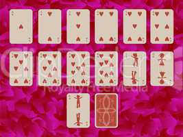 suit of hearts playing cards on purple background