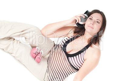 Portrait of pretty pregnant woman with headphones