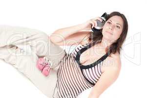 Portrait of pretty pregnant woman with headphones