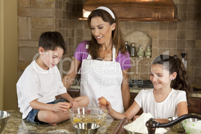 Mother, Son & Daughter Family In Kitchen Cooking Baking