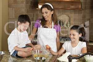 Mother, Son & Daughter Family In Kitchen Cooking Baking
