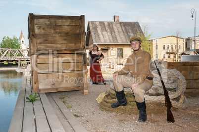 Lady and soldier with  gun in retro style picture