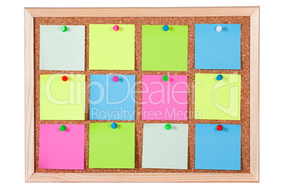 Colorful Paper Notes on Corkboard