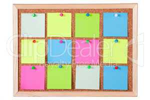 Colorful Paper Notes on Corkboard