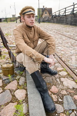 Retro style picture with resting soldier.