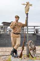 Retro style picture with soldier at tram stop.