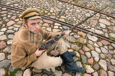 Soldier with boiler and gun in retro style picture