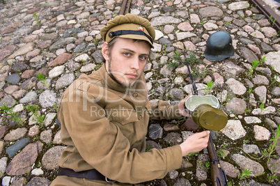 Soldier with boiler and gun in retro style picture