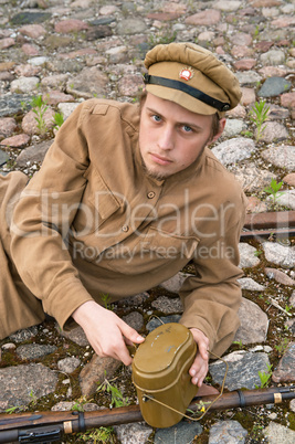 Soldier with boiler and gun in retro style picture