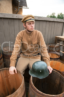 Retro style picture with soldier sitting on the butt