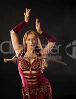 Arabian dancer with saber on breast
