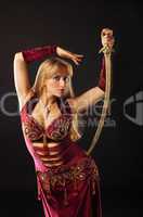 Arabian dancer with saber on hip