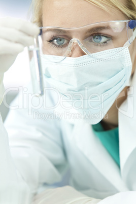 Female Scientist or Doctor With Test Tube In Laboratory